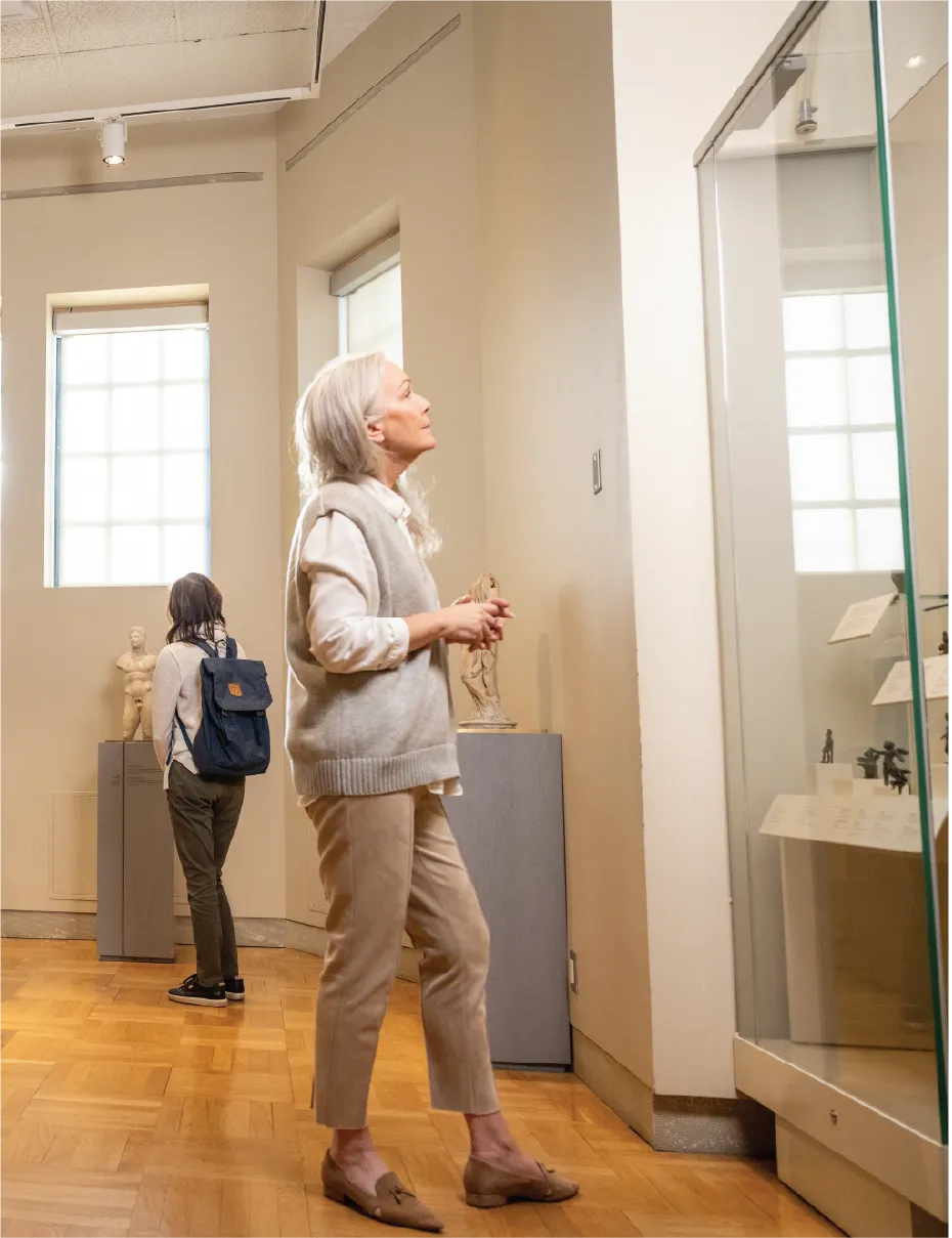 Visitor viewing artifacts at ROM.